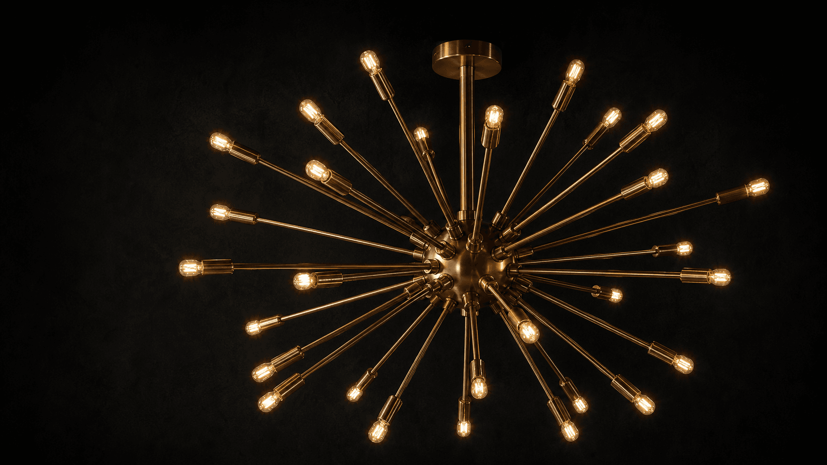 Gouden designlamp met warme lichtpunten tegen een zwarte achtergrond